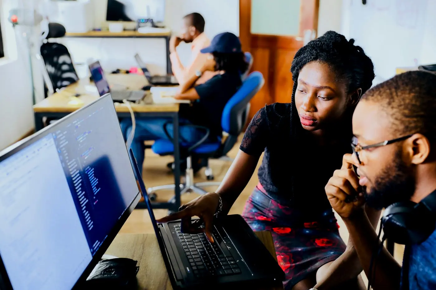 Two Herozite team members reviewing code together
