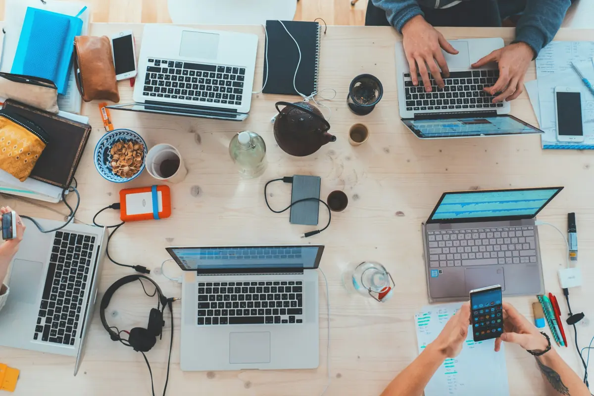 Laptops and notes on a shared work table